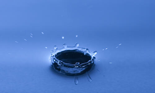 Water drop impact on a water surface